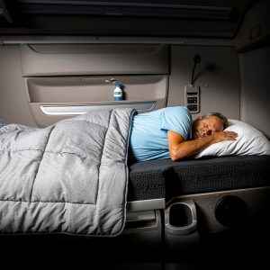 Berco - DAF Truck Interior Bed Driver Man Sleeping Night Dark Mattress Blanket Front View